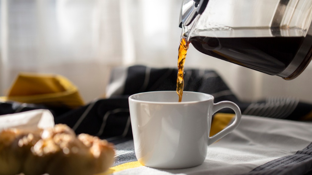 Drinking coffee at breakfast picture id903694512